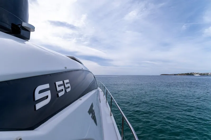  Yacht Photos Pics 2020 Filippetti S55S yacht cruising on open sea under a cloudy sky.