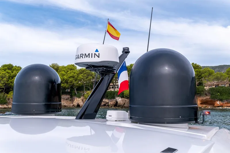 Yacht Photos Pics Rooftop of 2020 Filippetti S55S yacht with Garmin radar and flags, coastal background.