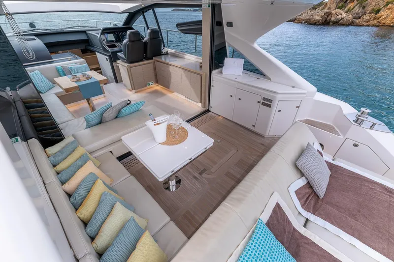  Yacht Photos Pics Luxurious 2020 Filippetti S55S yacht interior with elegant seating and ocean view.