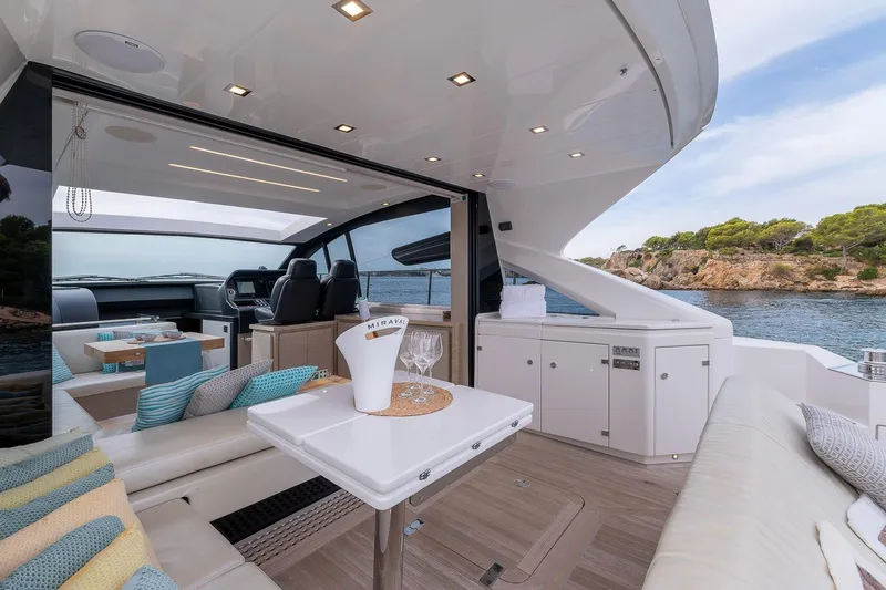  Yacht Photos Pics Luxurious 2020 Filippetti S55S yacht interior with elegant seating and scenic ocean view.