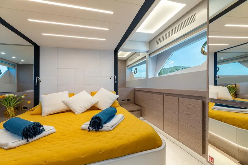  Yacht Photos Pics Luxurious 2020 Filippetti S55S yacht bedroom with modern design and vibrant yellow bedding.