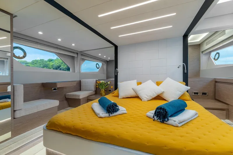  Yacht Photos Pics Luxurious 2020 Filippetti S55S yacht bedroom with modern design and scenic windows.