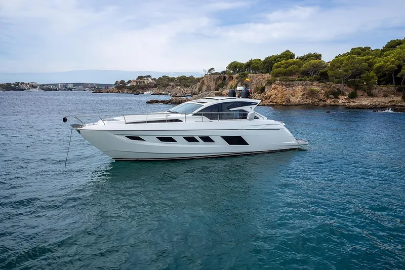  Yacht Photos Pics Luxury 2020 Filippetti S55S yacht anchored near scenic coastline.