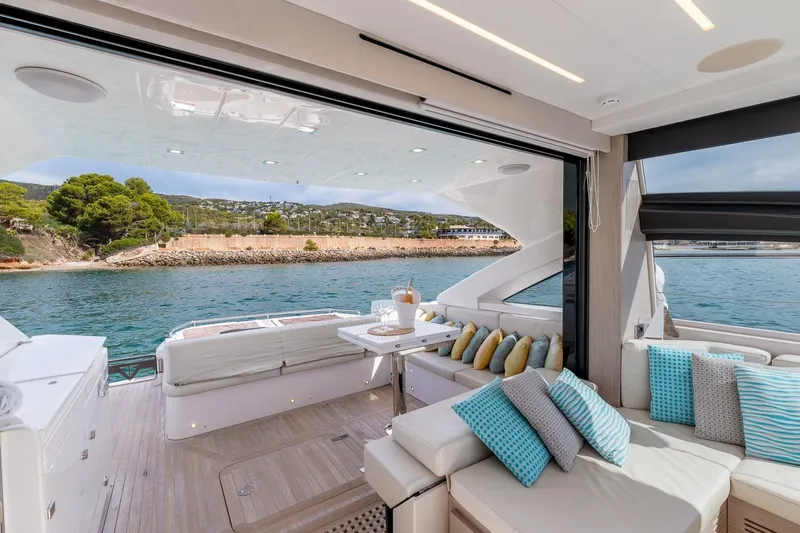  Yacht Photos Pics Luxurious 2020 Filippetti S55S yacht interior with elegant seating and scenic ocean view.
