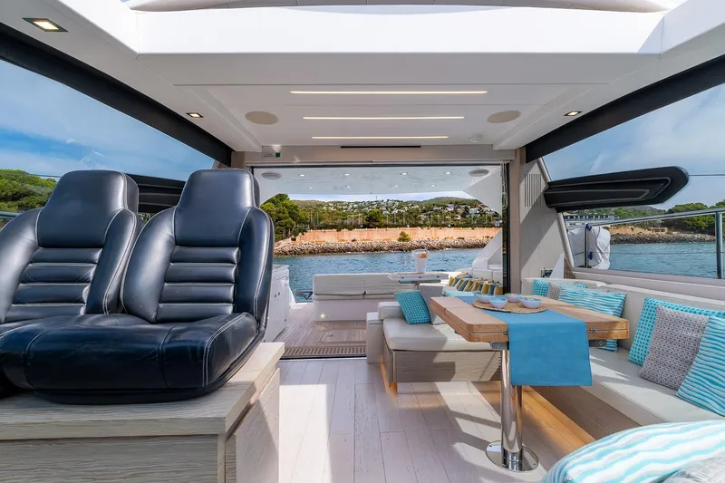  Yacht Photos Pics Luxurious interior of 2020 Filippetti S55S yacht with elegant seating and scenic ocean view.