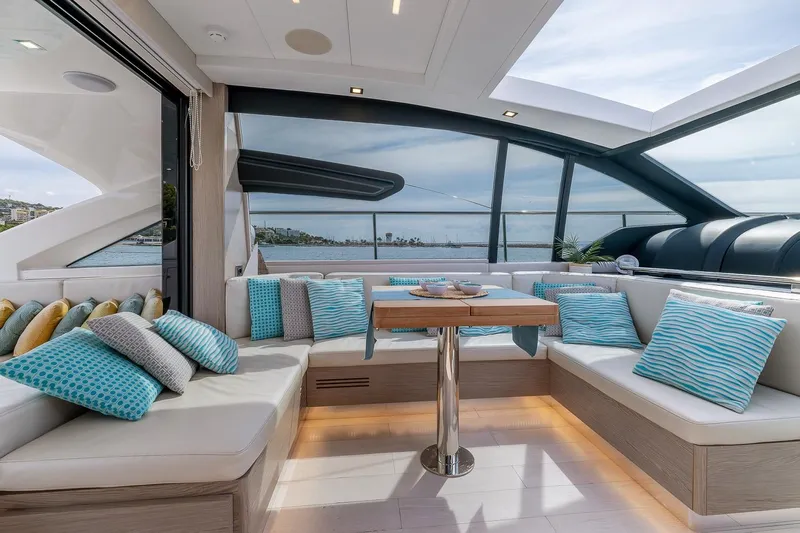  Yacht Photos Pics Luxurious 2020 Filippetti S55S yacht interior with elegant seating and panoramic windows.