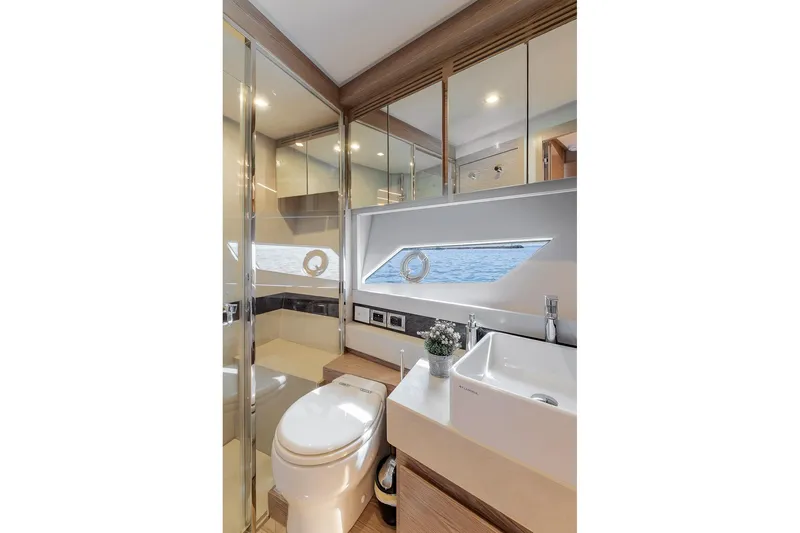  Yacht Photos Pics Luxurious bathroom interior of 2020 Filippetti S55S yacht with modern fixtures and sea view.
