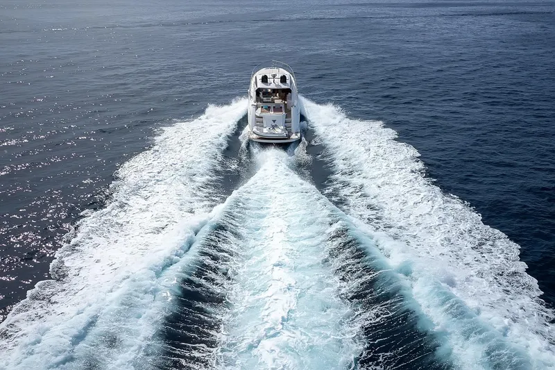  Yacht Photos Pics 2020 Filippetti S55S yacht cruising on open sea, leaving a foamy wake.