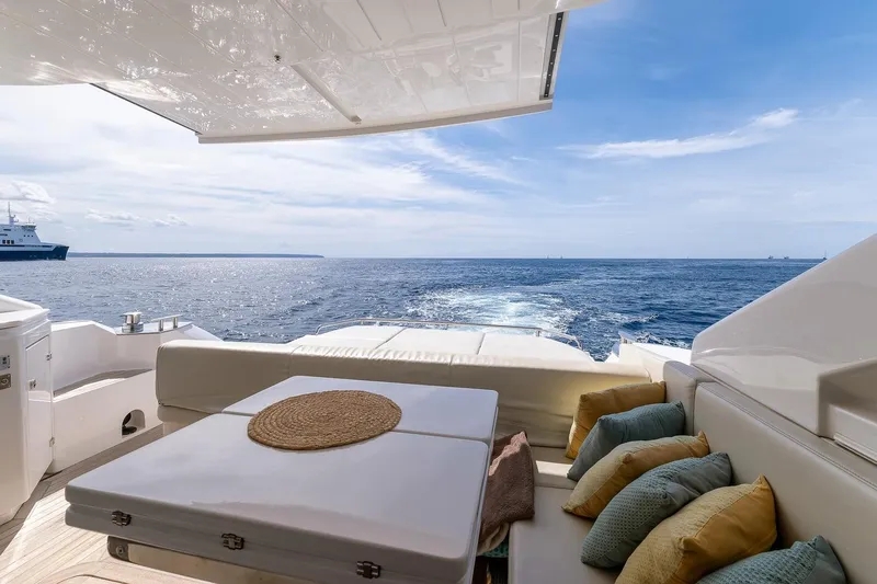  Yacht Photos Pics Luxury Filippetti S55S yacht deck with ocean view, 2020 model, featuring comfortable seating and cushions.