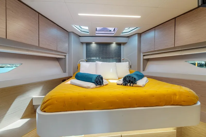  Yacht Photos Pics Luxurious cabin interior of 2020 Filippetti S55S yacht with modern design and cozy bedding.