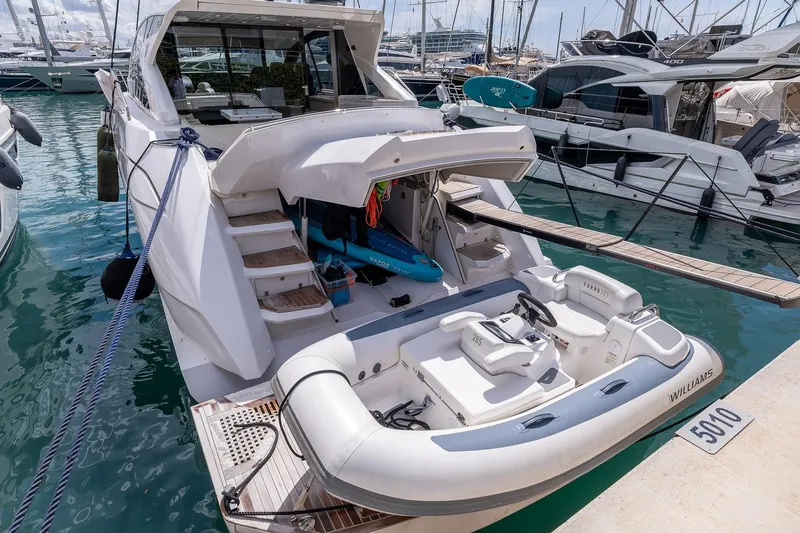  Yacht Photos Pics 2020 Filippetti S55S yacht docked with inflatable tender at marina.