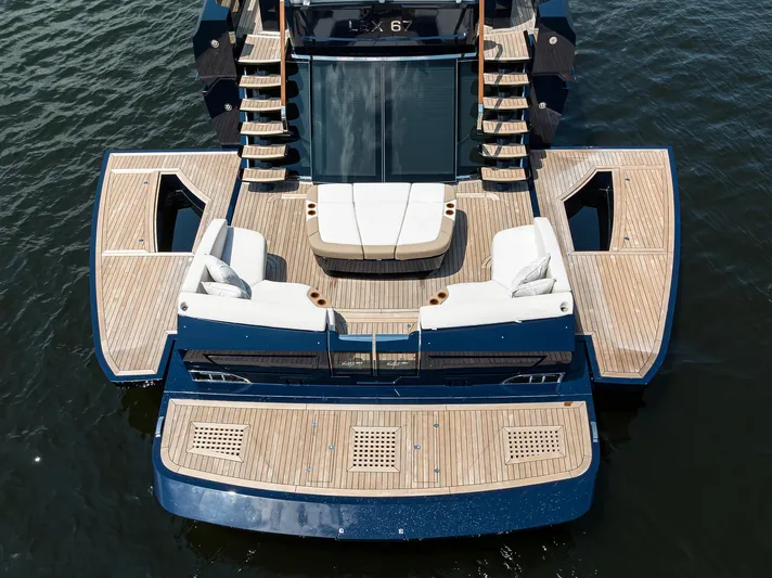 Lazzara Lsx 67 Yacht Photos Pics 2023 Lazzara LSX 67 yacht with spacious deck and luxurious seating on water.