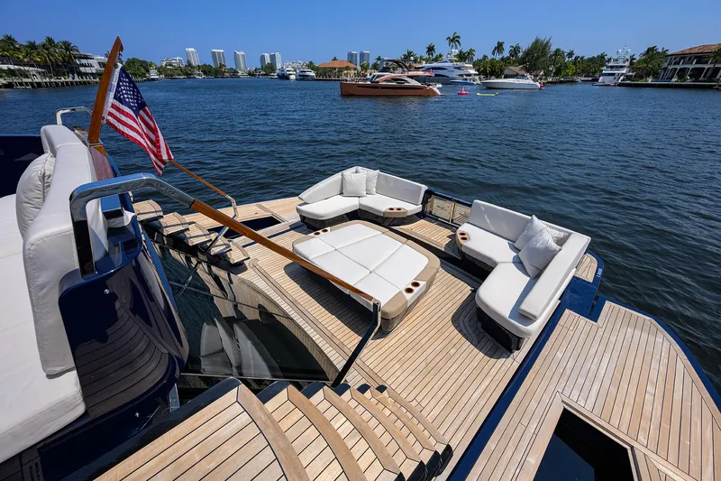 Lazzara Lsx 67 Yacht Photos Pics Luxurious 2023 Lazzara LSX 67 yacht with elegant deck seating on a sunny waterfront.