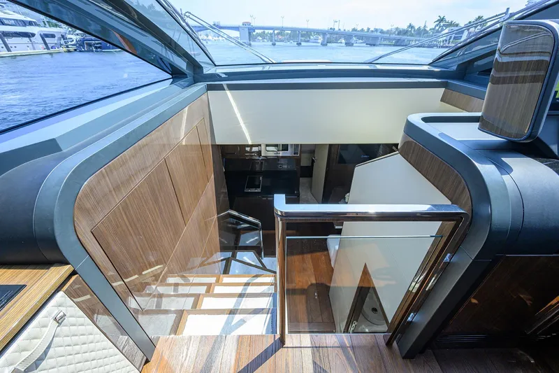 Lazzara Lsx 67 Yacht Photos Pics 2023 Lazzara LSX 67 yacht interior with modern wood and glass design.