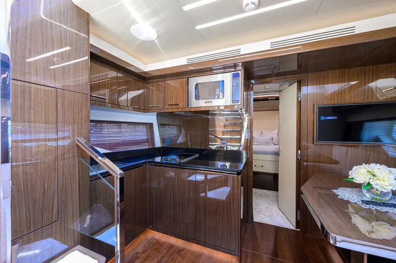 Lazzara Lsx 67 Yacht Photos Pics Luxurious 2023 Lazzara LSX 67 yacht interior with modern kitchen and elegant wood finishes.