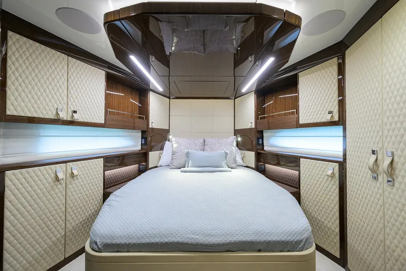 Lazzara Lsx 67 Yacht Photos Pics Luxurious bedroom interior of 2023 Lazzara LSX 67 yacht with elegant design and ambient lighting.