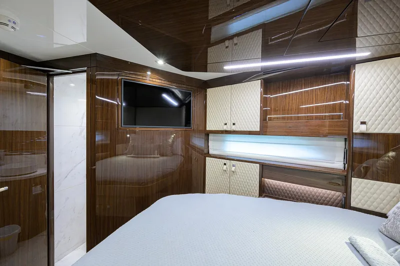 Lazzara Lsx 67 Yacht Photos Pics Luxurious interior of 2023 Lazzara LSX 67 yacht with modern wood paneling and TV.