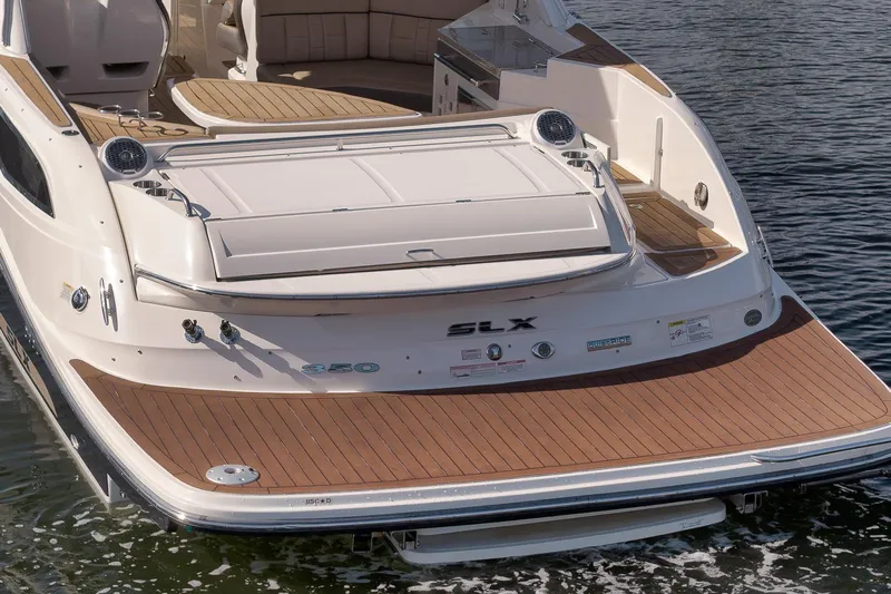  Yacht Photos Pics 2016 Sea Ray 350 SLX boat with teak deck, docked on calm water.