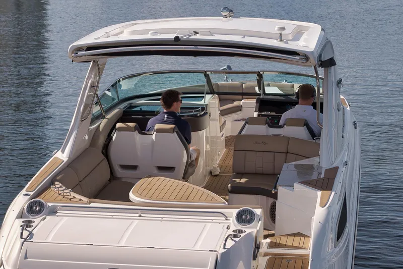  Yacht Photos Pics 2016 Sea Ray 350 SLX boat with passengers on a calm water surface.