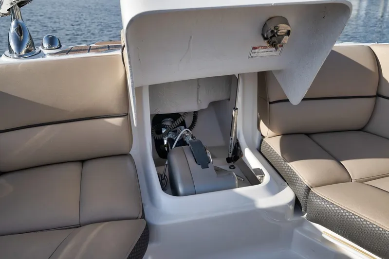  Yacht Photos Pics 2016 Sea Ray 350 SLX boat interior with open storage compartment and beige seating.