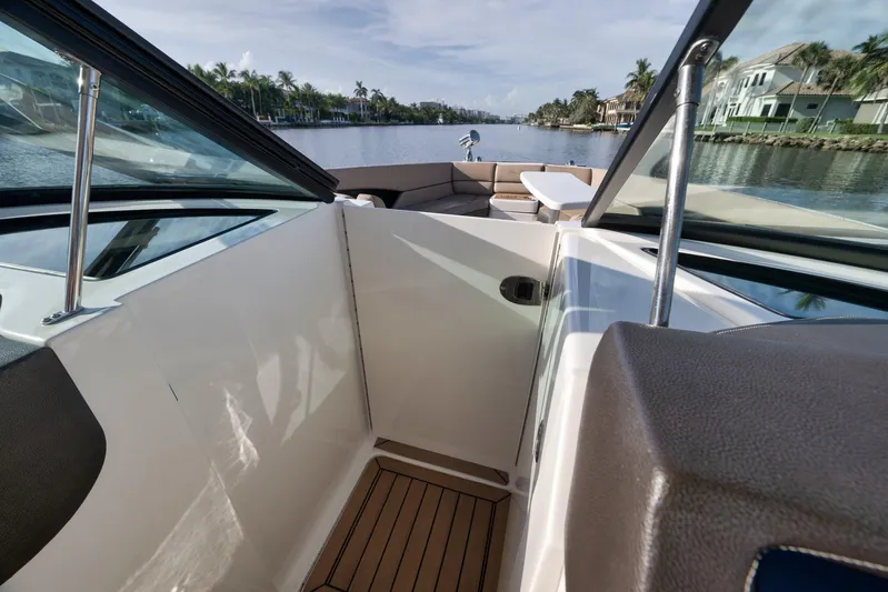  Yacht Photos Pics 2016 Sea Ray 350 SLX boat interior with waterfront view, featuring sleek design and seating area.
