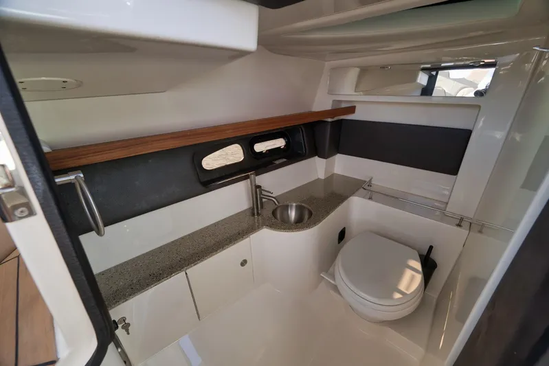  Yacht Photos Pics 2016 Sea Ray 350 SLX boat interior bathroom with sink and toilet.