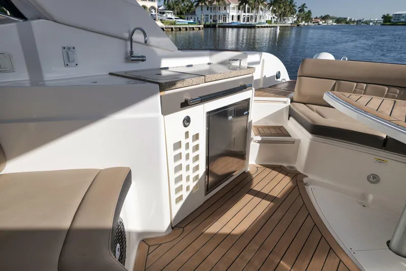  Yacht Photos Pics Luxurious 2016 Sea Ray 350 SLX boat interior with seating, kitchenette, and waterfront view.