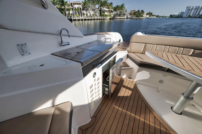  Yacht Photos Pics Luxurious 2016 Sea Ray 350 SLX boat interior with kitchenette and seating area by the water.