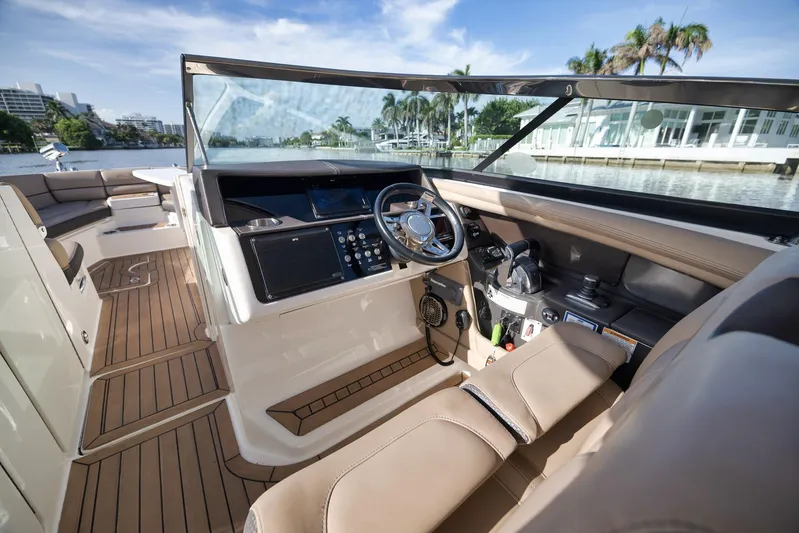  Yacht Photos Pics 2016 Sea Ray 350 SLX boat interior with luxurious seating and modern dashboard controls.