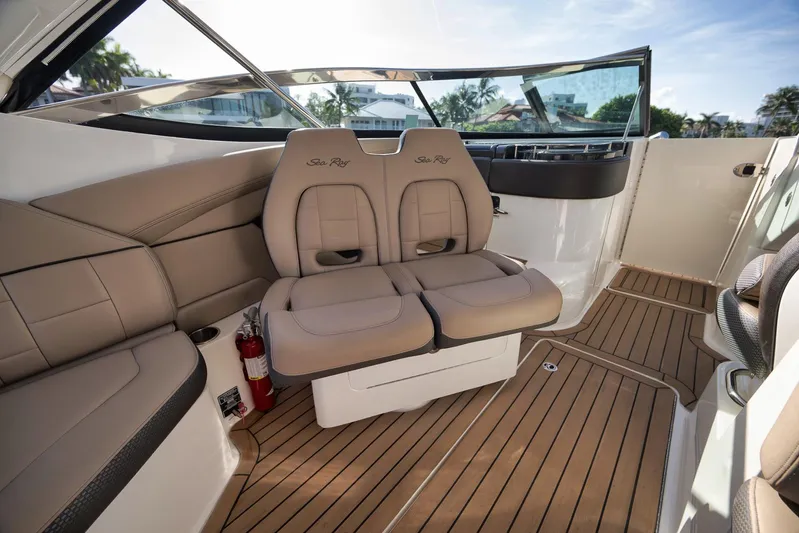  Yacht Photos Pics Interior of 2016 Sea Ray 350 SLX boat with beige seating and wooden flooring.