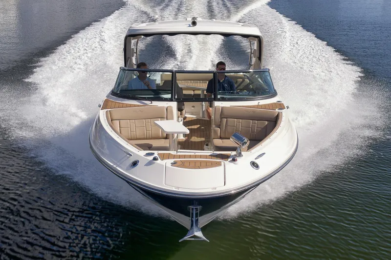  Yacht Photos Pics 2016 Sea Ray 350 SLX cruising on water, showcasing luxury seating and sleek design.