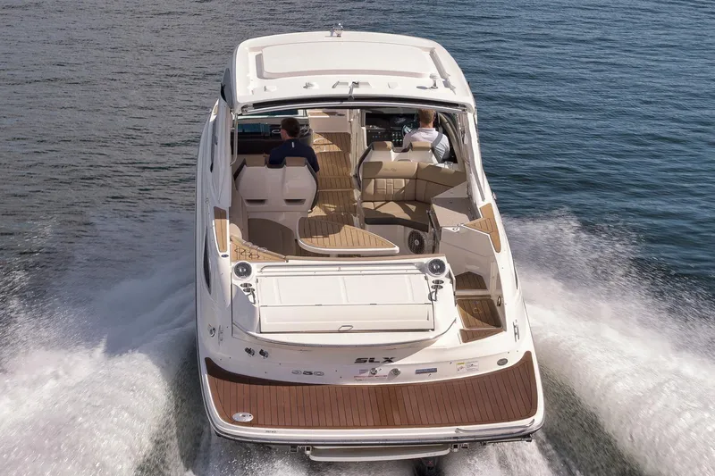 Yacht Photos Pics 2016 Sea Ray 350 SLX cruising on open water, rear view.