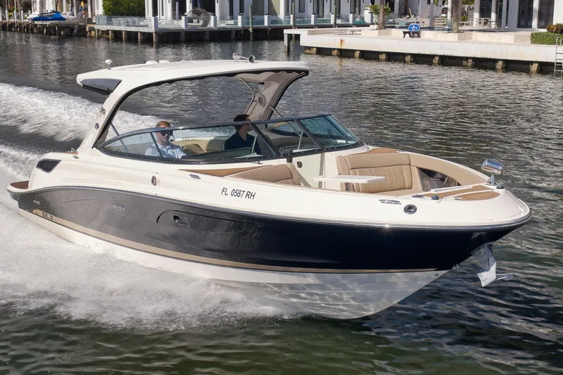  Yacht Photos Pics 2016 Sea Ray 350 SLX cruising on water near waterfront homes.