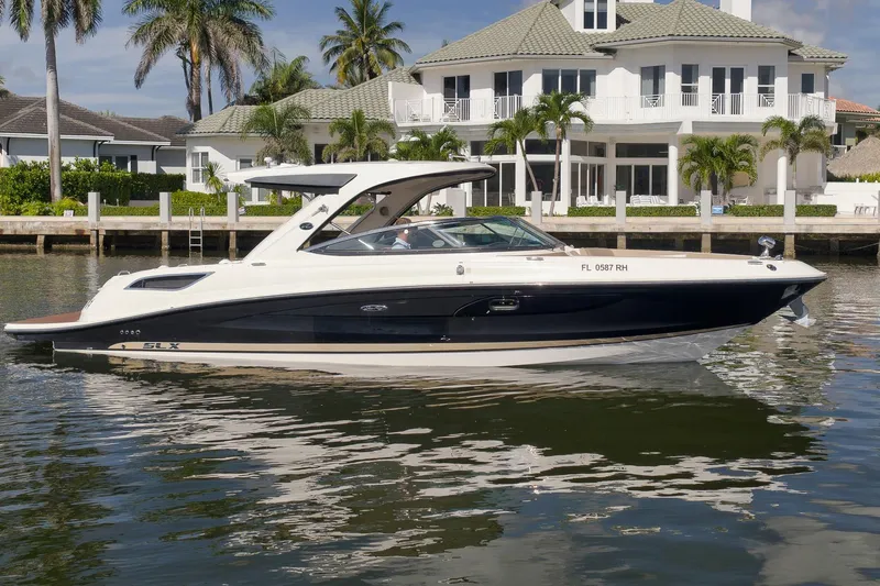  Yacht Photos Pics 2016 Sea Ray 350 SLX boat docked near luxury waterfront home.