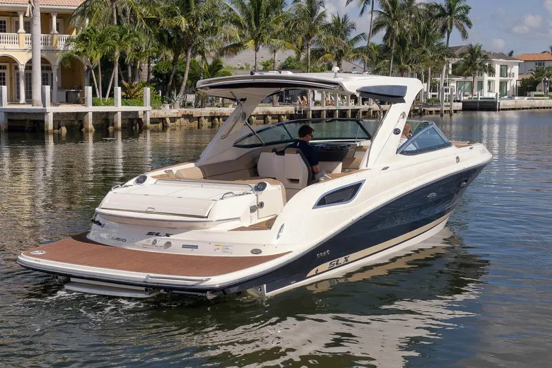  Yacht Photos Pics 2016 Sea Ray 350 SLX boat cruising near waterfront homes and palm trees.