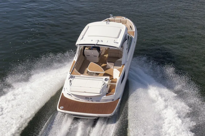 Yacht Photos Pics 2016 Sea Ray 350 SLX cruising on open water, showcasing sleek design and powerful performance.