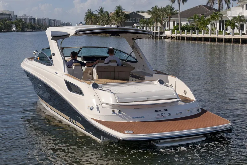  Yacht Photos Pics 2016 Sea Ray 350 SLX luxury boat cruising on a scenic waterway.