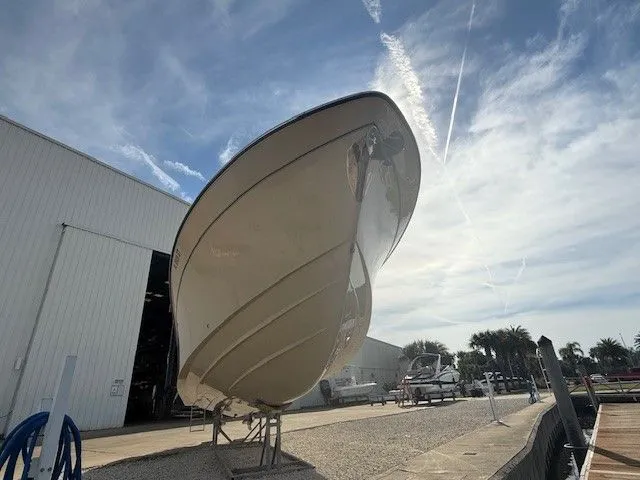  Yacht Photos Pics 2021 Grady-White Canyon 306 boat on display under a clear sky.