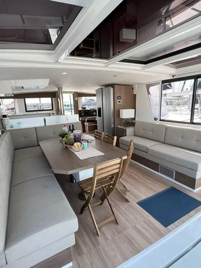  Yacht Photos Pics Spacious interior of 2023 Bali 4.6 yacht with modern dining area and seating.