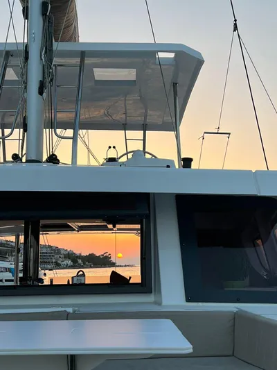  Yacht Photos Pics 2023 Bali 4.6 yacht at sunset, featuring sleek design and modern amenities.