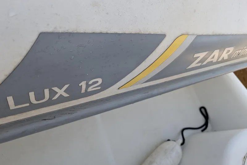  Yacht Photos Pics Close-up of ZAR mini Lux 12 inflatable boat detail, featuring branding and design elements.