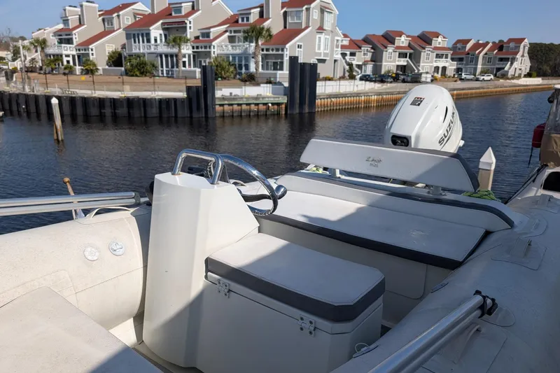  Yacht Photos Pics 2001 Carver 570 Voyager Pilothouse boat docked near waterfront homes.