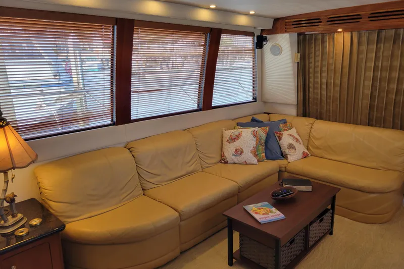  Yacht Photos Pics Luxurious interior of 2001 Carver 570 Voyager Pilothouse with beige leather seating.