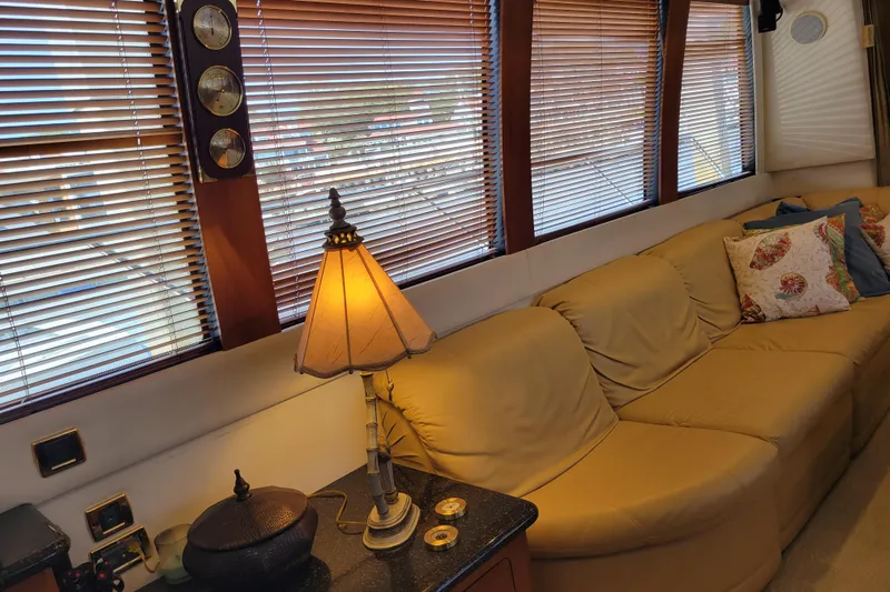  Yacht Photos Pics Luxurious interior of 2001 Carver 570 Voyager Pilothouse with cozy seating and elegant decor.