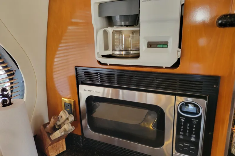  Yacht Photos Pics Interior of 2001 Carver 570 Voyager Pilothouse with coffee maker and microwave.