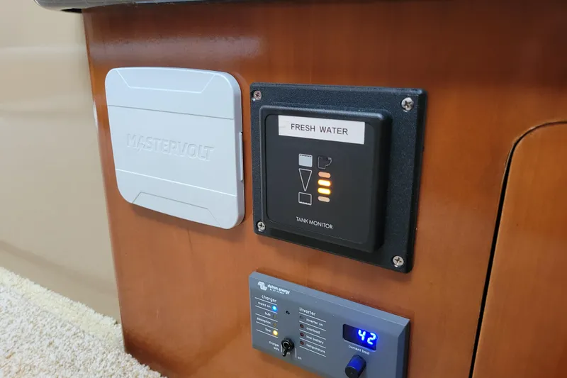  Yacht Photos Pics Control panel on 2001 Carver 570 Voyager Pilothouse, featuring fresh water tank monitor.