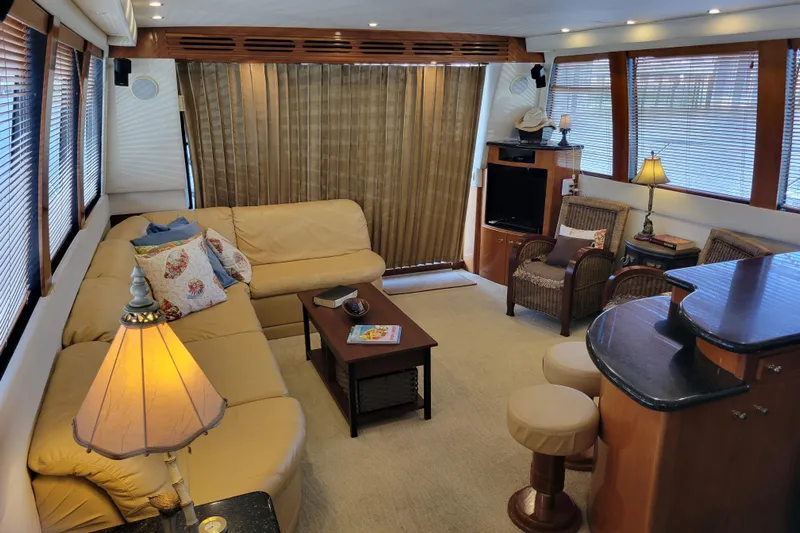  Yacht Photos Pics Luxurious interior of 2001 Carver 570 Voyager Pilothouse with cozy seating and elegant decor.