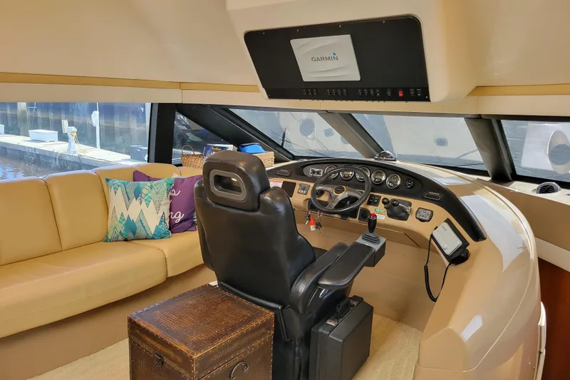  Yacht Photos Pics Pilothouse interior of 2001 Carver 570 Voyager with leather seating and Garmin navigation system.