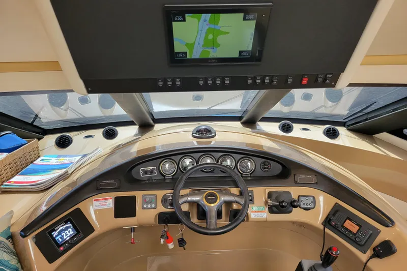  Yacht Photos Pics Interior view of 2001 Carver 570 Voyager Pilothouse helm with navigation equipment.