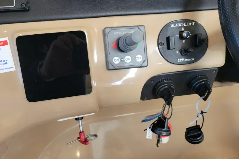  Yacht Photos Pics Control panel of a 2001 Carver 570 Voyager Pilothouse with searchlight and side-power controls.